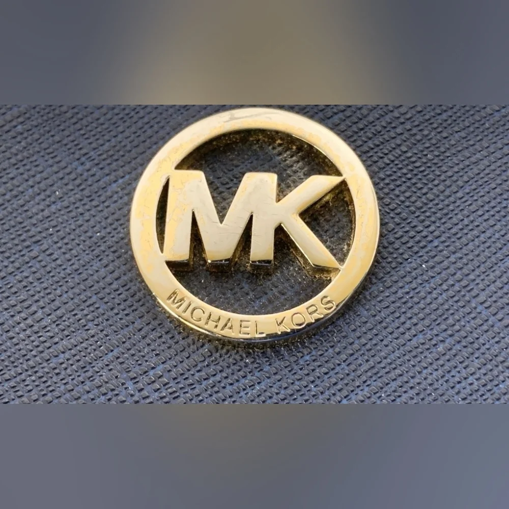 Michael Kors Blue Zip-Around Wallet with Gold Hardware.
